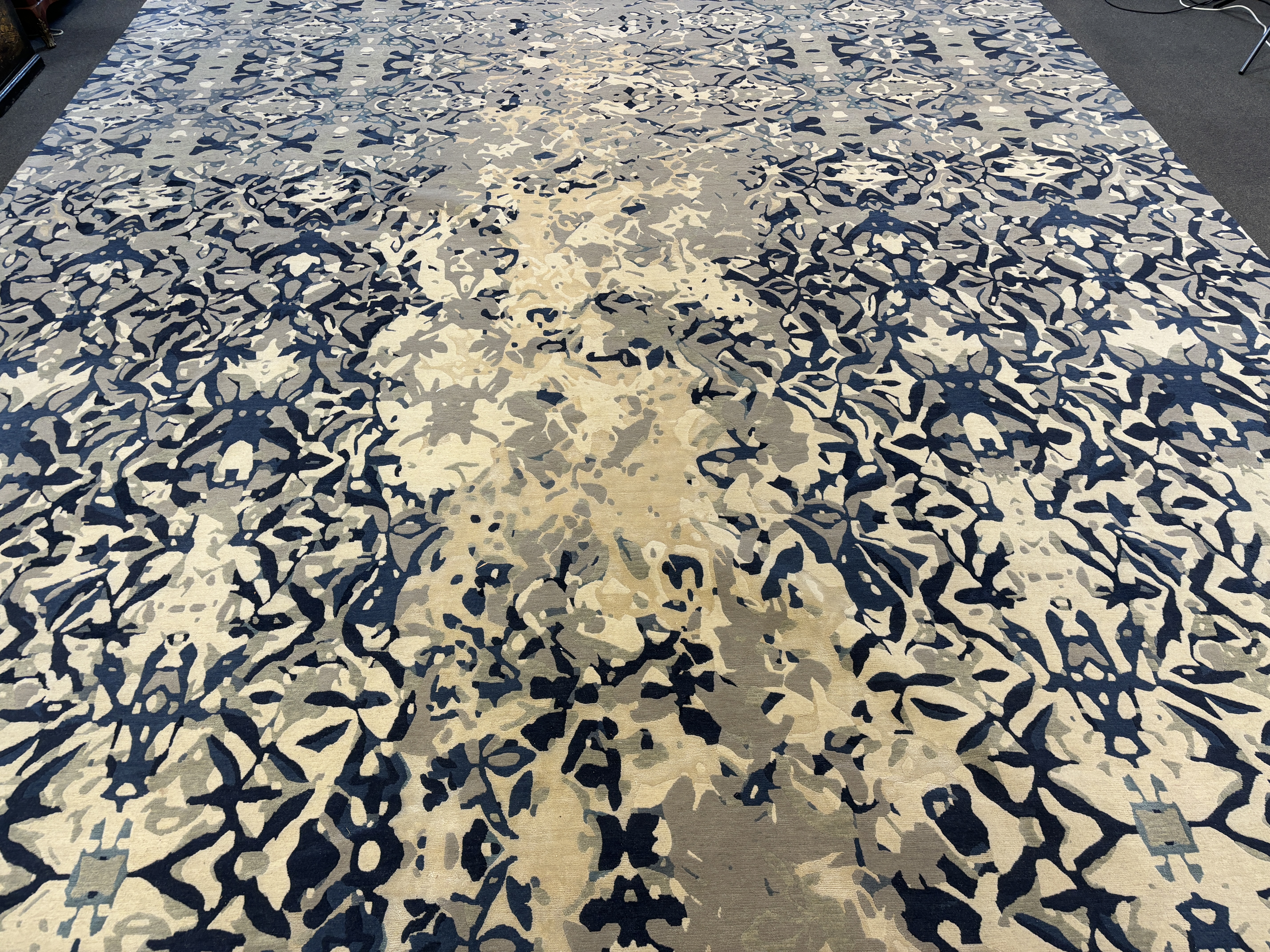 An Elizabeth Ashard 'Moghul', a silk and wool blue tones pattern carpet, 665 x 440cm
